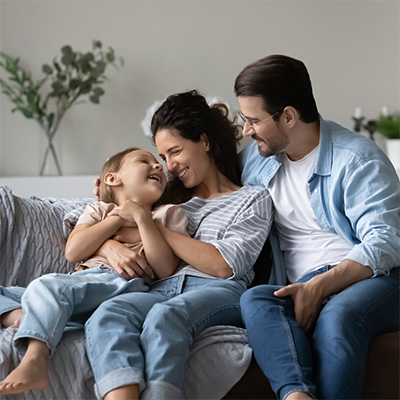 family sitting on couch