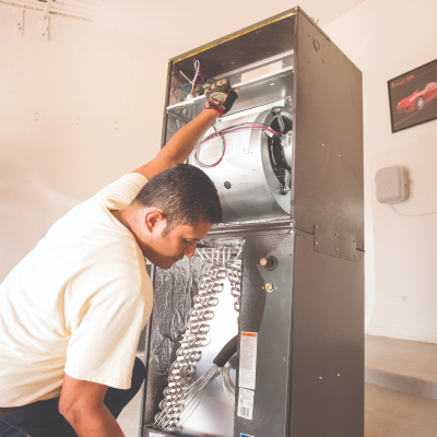 man installing a new furnace