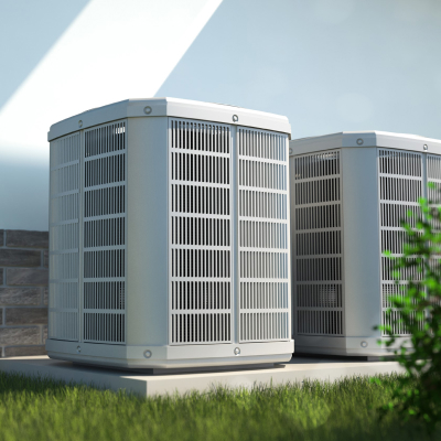 hvac units installed outside a home with green grass
